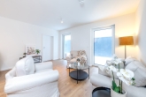 Wohnzimmer - Zur Kapitalanlage – vermietete Neubauwohnung