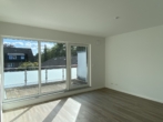 Wohnzimmer - Erstklassiges Wohnen in der Großen Gänseweide – modern & mit Dachterrasse!